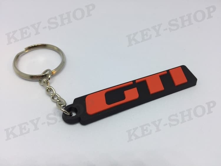 Porte-clés PVC souple Peugeot sigle GTI 205 309 monogramme badge